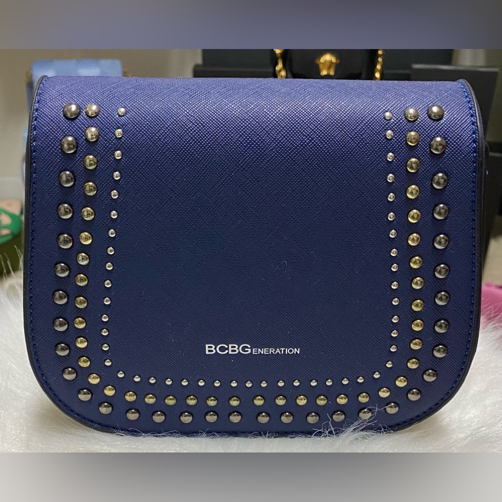 Cute blue crossbody purse with studded detail.NWT.Can be paired with blue Reebok